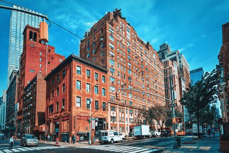 New York, USA- September 05, 2017 : Urban cityscape of New York. Midtown district. Street, cars, people and tourists on it.の写真素材