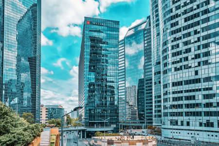 PARIS, FRANCE - JULY 06, 2016 :La Defense, Business Quarter with businessmen in the streets, area of Paris,  French financial center with skyscrapers and modern buildings.のeditorial素材