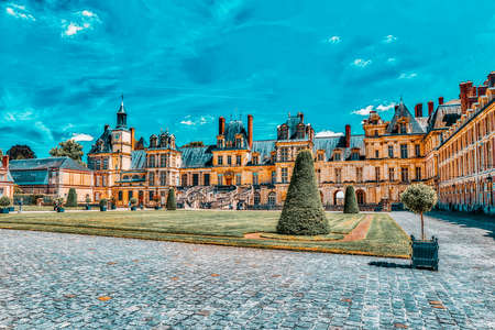 FONTAINEBLEAU, FRANCE- JULY 09, 2016 : Suburban Residence of the France Kings - facade  beautiful Chateau Fontainebleau and surrounding his park.