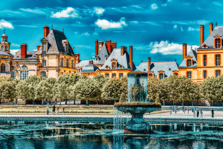 FONTAINEBLEAU, FRANCE - JULY 09, 2016 :Suburban Residence of the France Kings - beautiful Chateau Fontainebleau with the fountain on foreground.のeditorial素材
