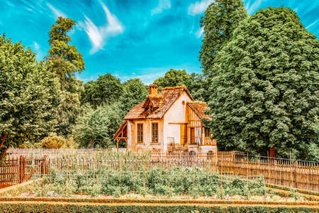 VERSAILLES, FRANCE - JULY 02, 2016 : Landscape of hamlet Queen Marie Antoinette's estate near Versailles Palace. Palace Versailles -most beautiful palace in France.のeditorial素材