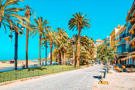 Sitges, Spain - June 14, 2017 : View of the embankment and the promenade in small resort town-Sitges...