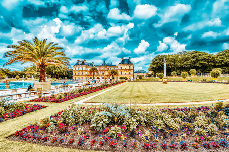PARIS, FRANCE - JULY 05, 2016 : Luxembourg Palace and park in Paris with people, the Jardin du Luxembourg, one of the most beautiful gardens in Paris. France.のeditorial素材