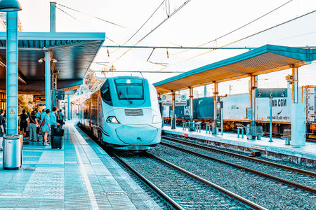 TARRAGONA, SPAIN - SEPT 10: Hi-Speed Train arriving  to Railways stantion . September 10, 2014 in Tarragona, Spain. This train has  a top speed is 200 km\ h.のeditorial素材