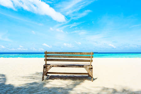 A wooden bench standing near Indian Ocean.  Maldives. Maldives Islands.の写真素材