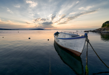 An image of lonely boat at sunset, near Burgas, Bulgariaの写真素材