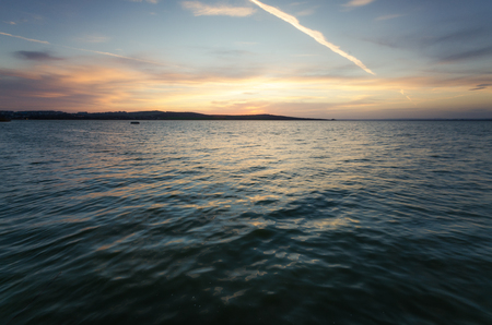 An image of sunset over the lake of Burgasの写真素材