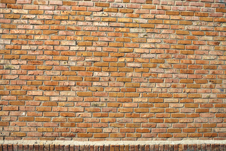 Old grunge brick wall backgroundの写真素材