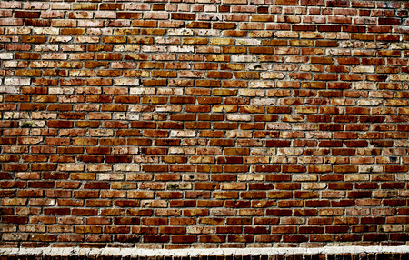 Old grunge brick wall backgroundの写真素材