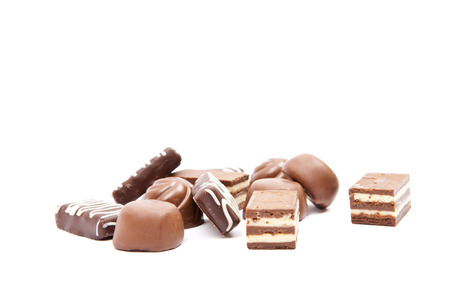 Chocolates heap against a white backgroundの写真素材