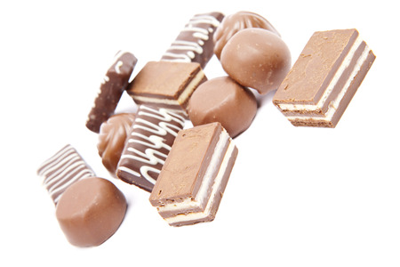 Chocolates heap against a white backgroundの写真素材