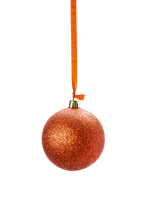 red Christmas ball with bow isolated on whiteの写真素材