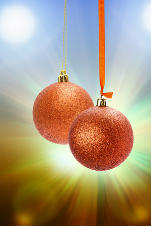 red Christmas ball with bow isolated on whiteの写真素材