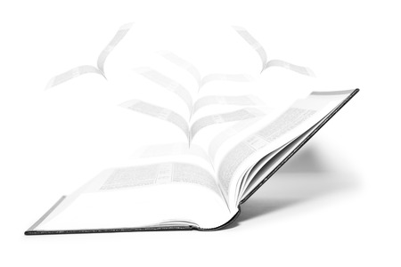 Open book and pages flyingの写真素材
