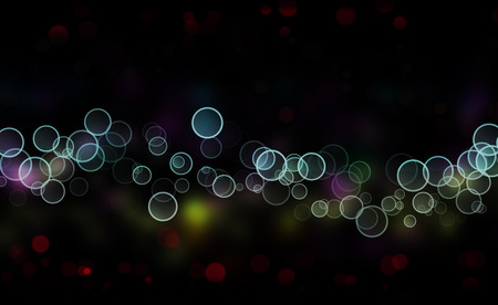 Abstract christmas bokeh lights as background on blackの写真素材