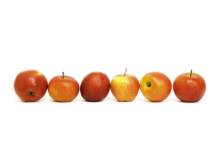 juicy red apples isolated on whiteの写真素材