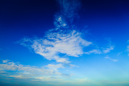 Blue sky with clouds and sunの写真素材