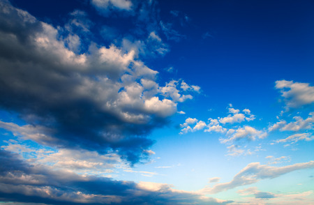 Blue sky with clouds and sunの写真素材