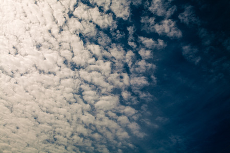 Blue sky with white clouds backgroundの写真素材