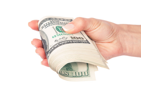 Many dollars falling on woman's hand with money