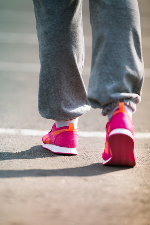 training on a stadium at sunset of a sunの写真素材