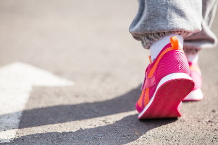training on a stadium at sunset of a sunの写真素材
