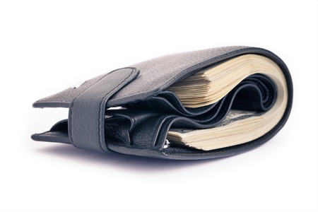 One black purse with the big pack of dollarsの写真素材