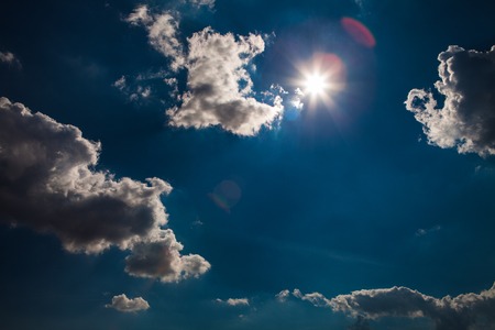 Blue sky with white and grey clouds