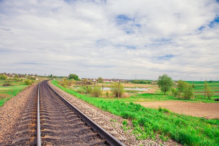 railroad tracks going into the distance in the summerの写真素材