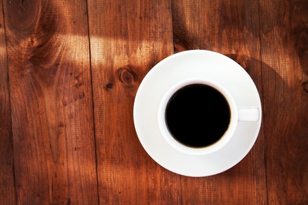 Cup of coffee on a wooden table.の写真素材