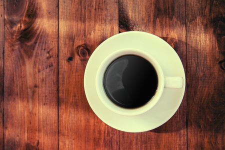 Cup of coffee on a wooden table.の写真素材