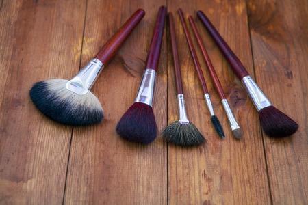 isolated brushes on a wooden backgroundの写真素材