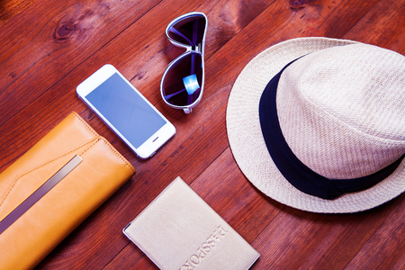 objects for travel isolated on a wooden backgroundの写真素材