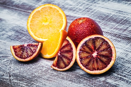 Sicilian orange isolated on a wood background