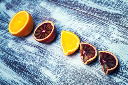 Sicilian orange isolated on a wood backgroundの写真素材