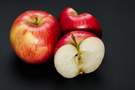 red apple isolated on a black backgroundの写真素材