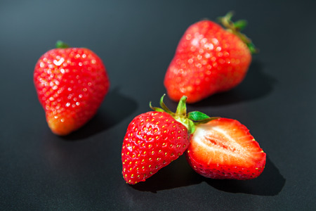 strawberry isolated on a black backgroundの写真素材