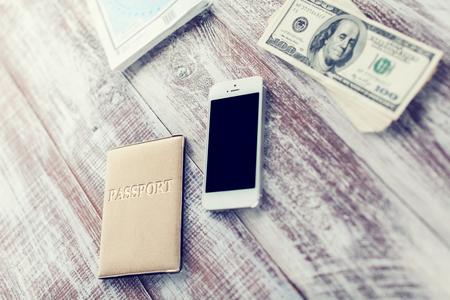 objects for travel isolated on a wooden backgroundの写真素材