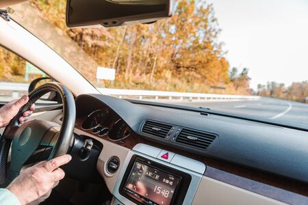 The man driving the modern car