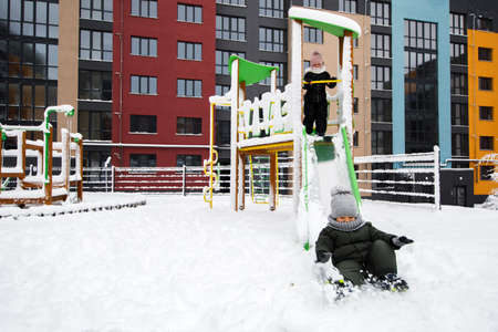 Childrens playground covered with snow in winter.
