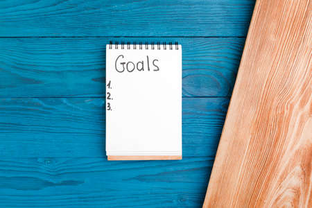New Year goals for 2022, plumbing tools and notebook in workshop.の写真素材
