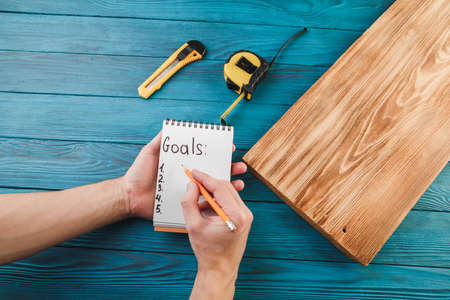 New Year goals for 2022, plumbing tools and notebook in workshop.の写真素材