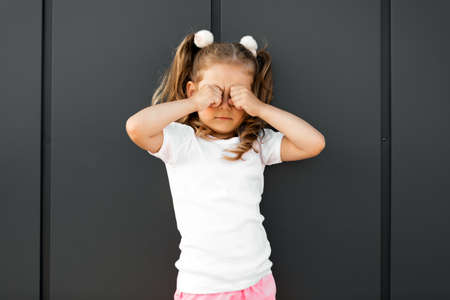 little girl in white t-shirt. space for your design. Mockup for printの写真素材