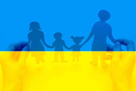 There is no war. People cut out of paper on a blue and yellow background. conceptual war in Ukraine