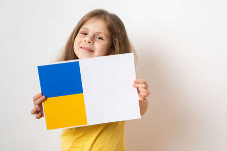Portrait little girl calls to Stop war in Ukraine, raises banner with inscription stop the war in...