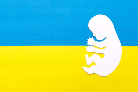 There is no war. People cut out of paper on a blue and yellow background. conceptual war in Ukraineの写真素材