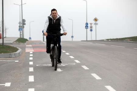 father riding bike with son in bike seat. High quality photoの写真素材