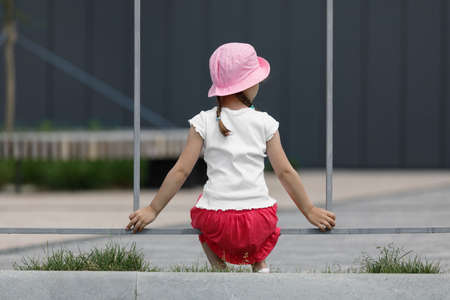 little girl in white t-shirt. space for your design. Mockup for printの写真素材