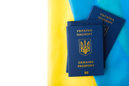 international passport of ukraine against the background of the national flag. war on ukraineの写真素材