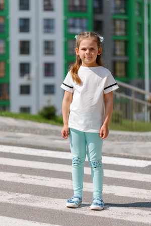 little girl in white t-shirt.の写真素材